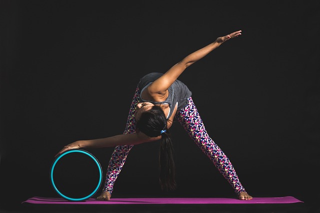 home workout setup with person practicing yoga mobility pose with correct alignment